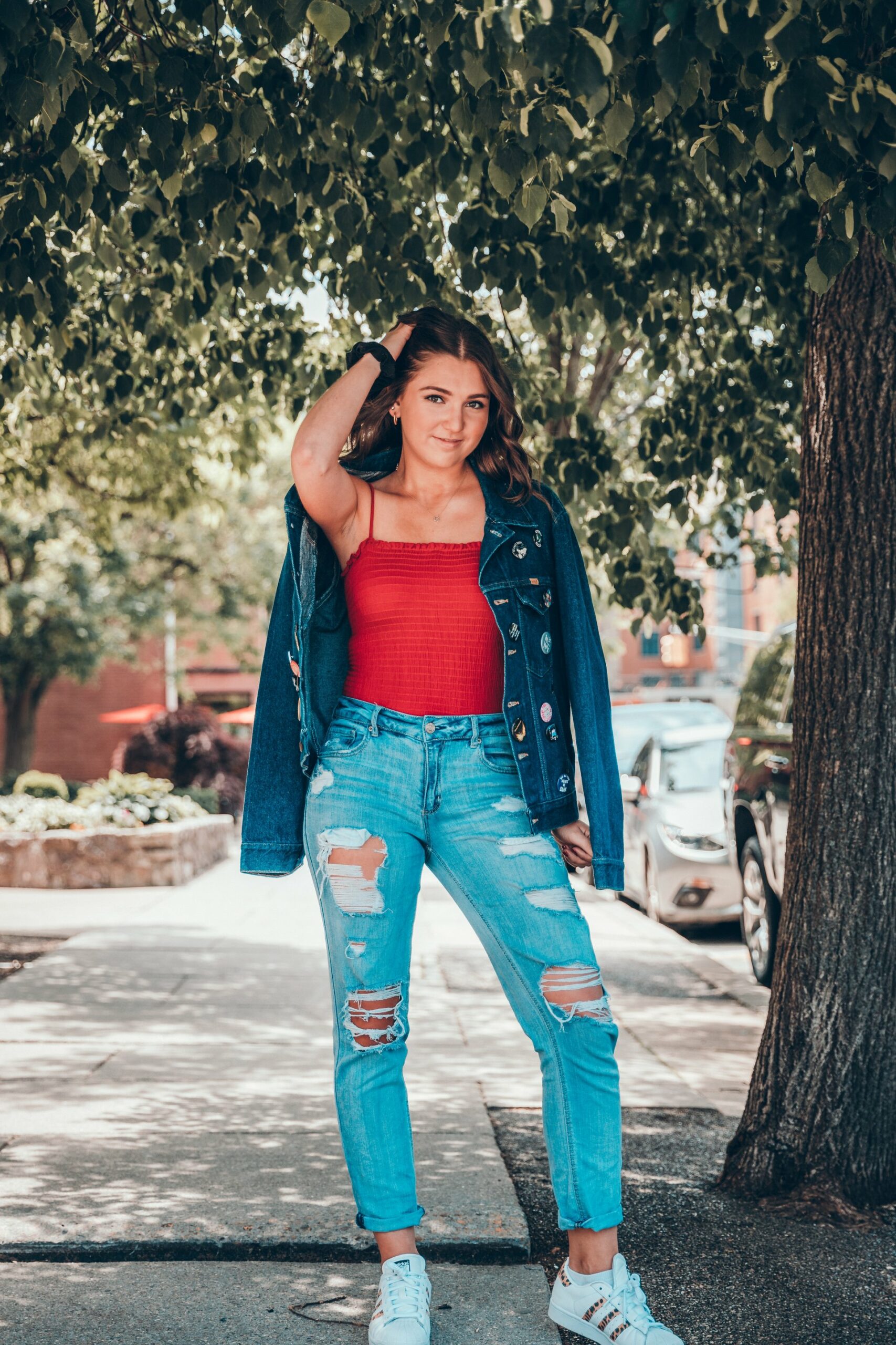 Woman wearing red top with denim jacket