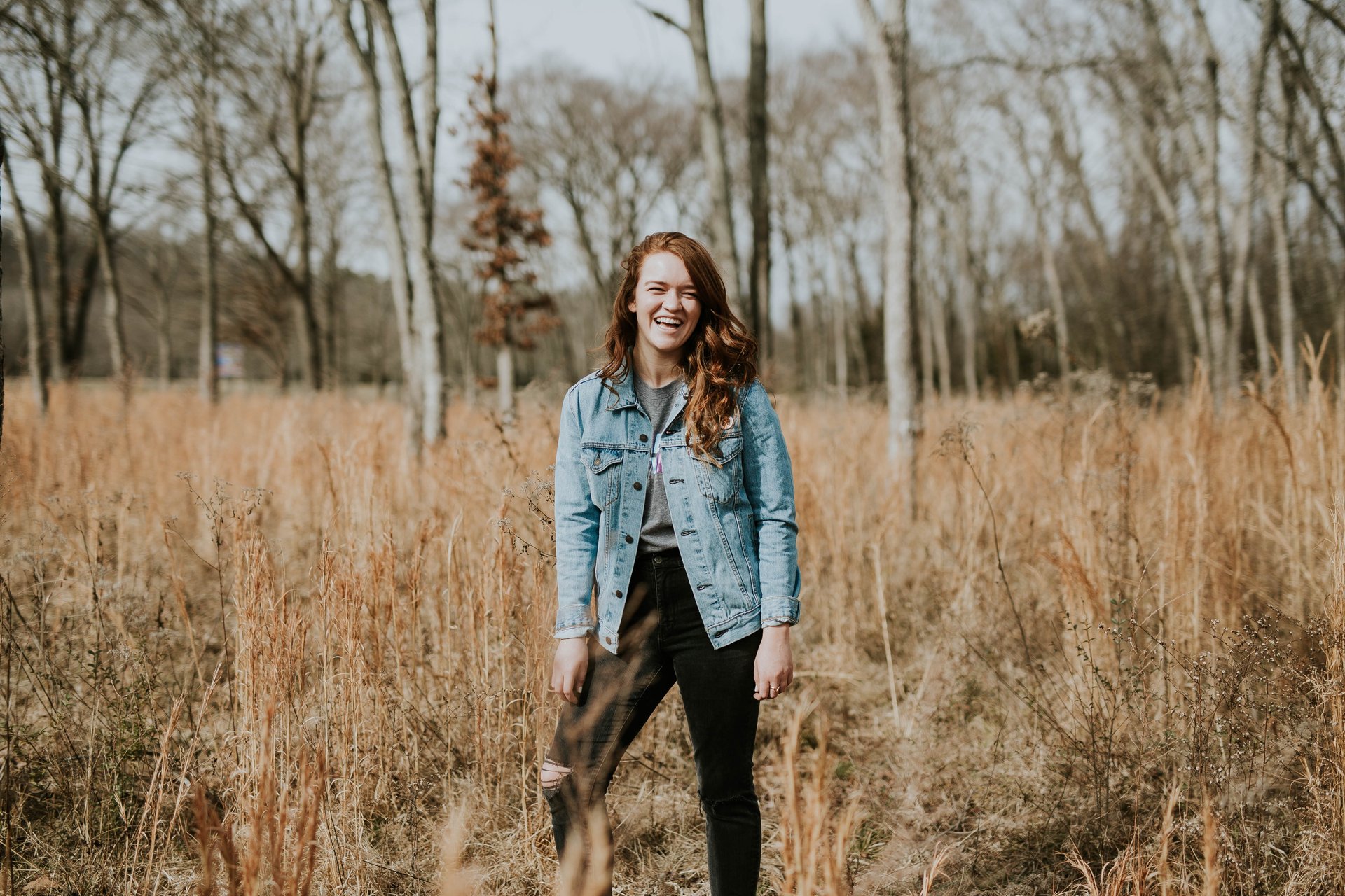 Woman wearing denim jacket and black jeans