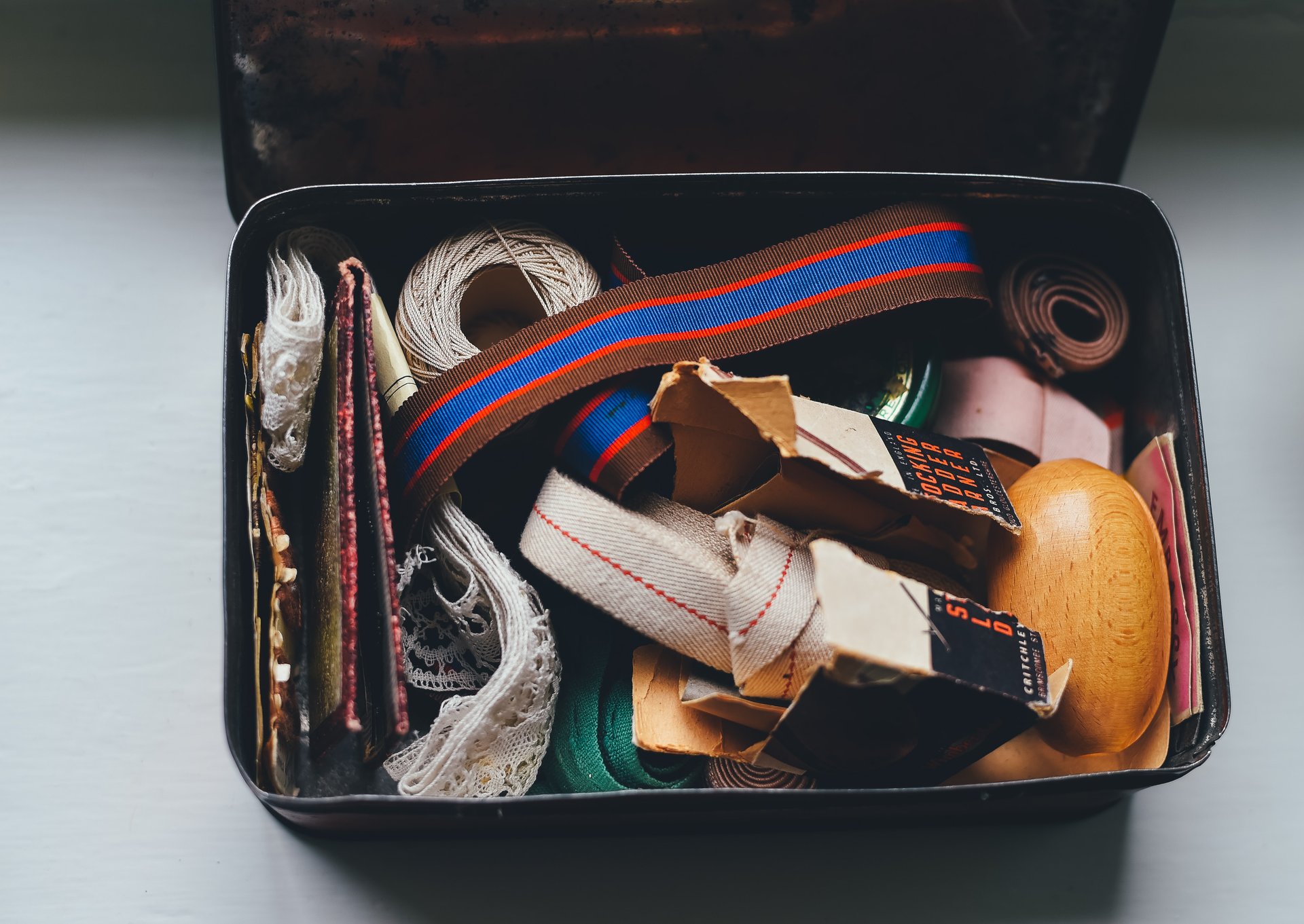 Different sewing tools inside a box