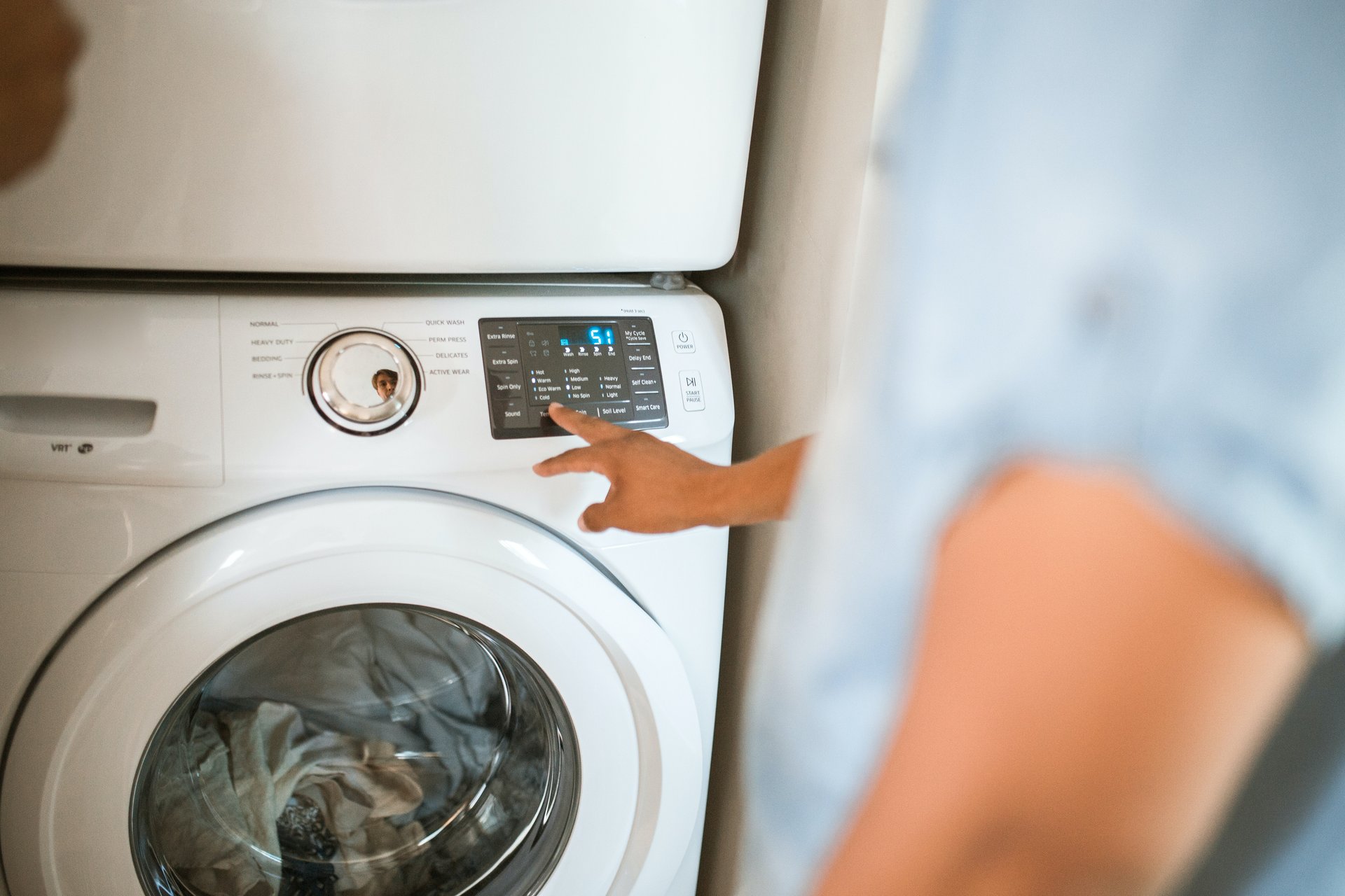 Man setting up washing machine