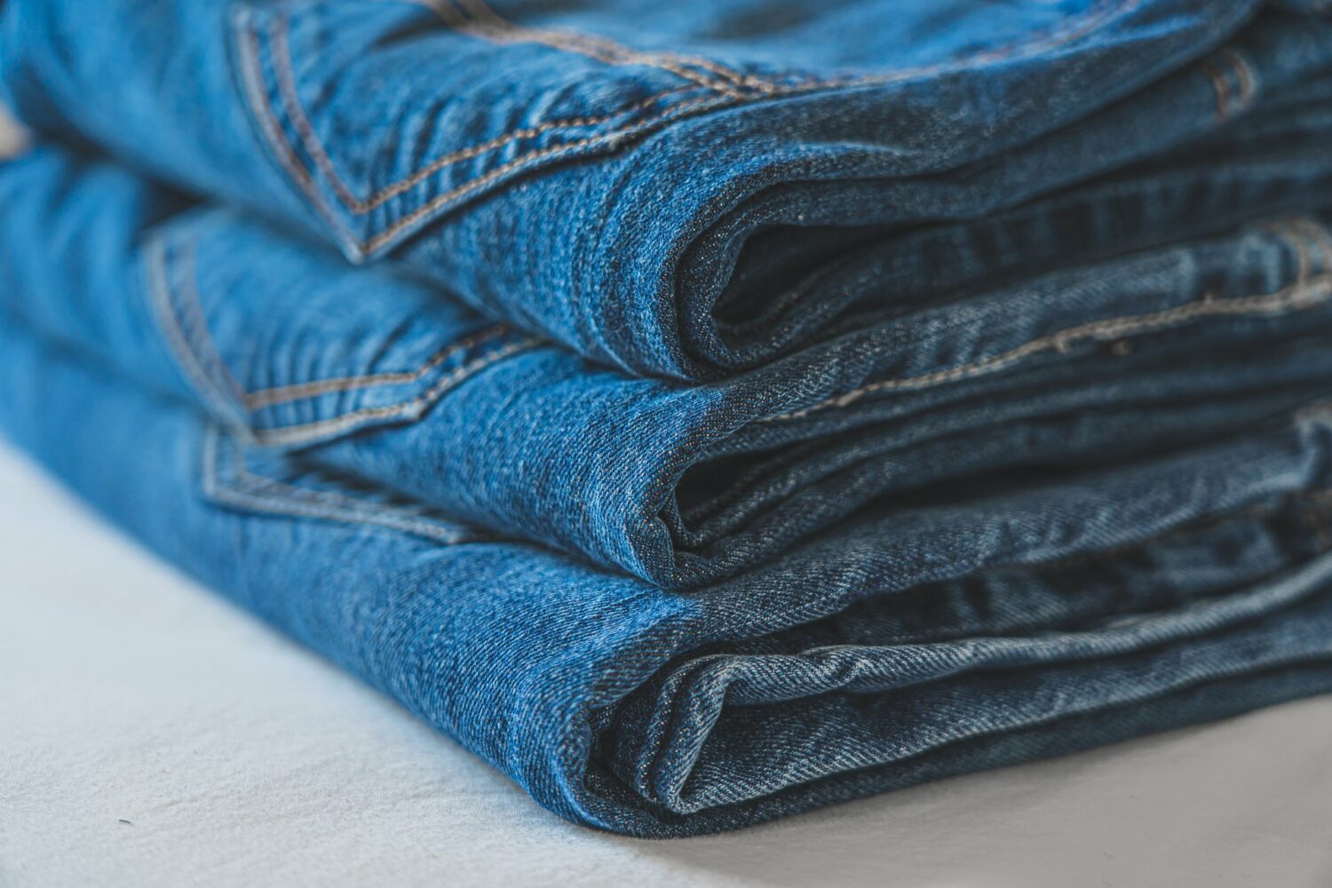 Stack of blue jeans