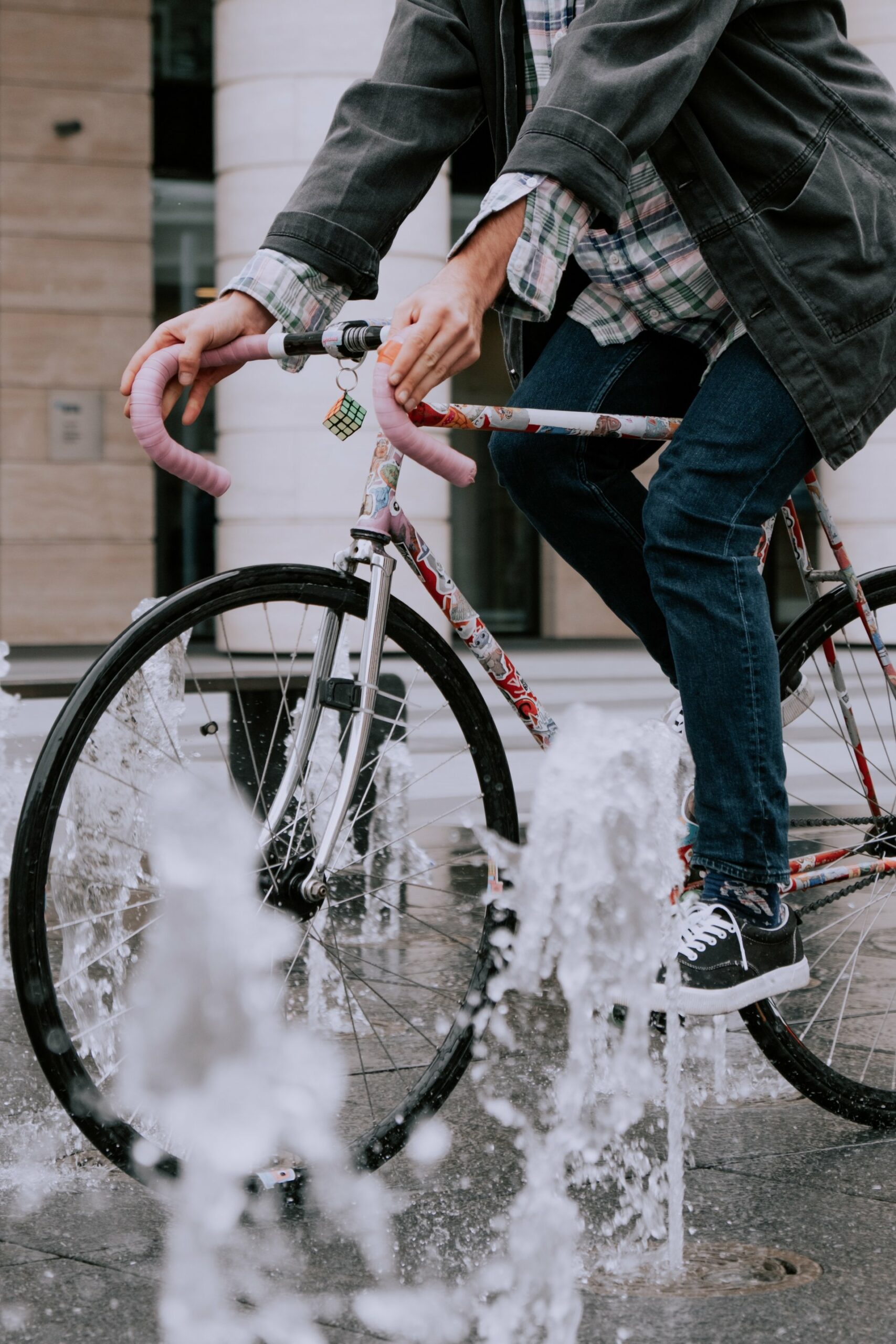 Man wearing jeans while riding a bike