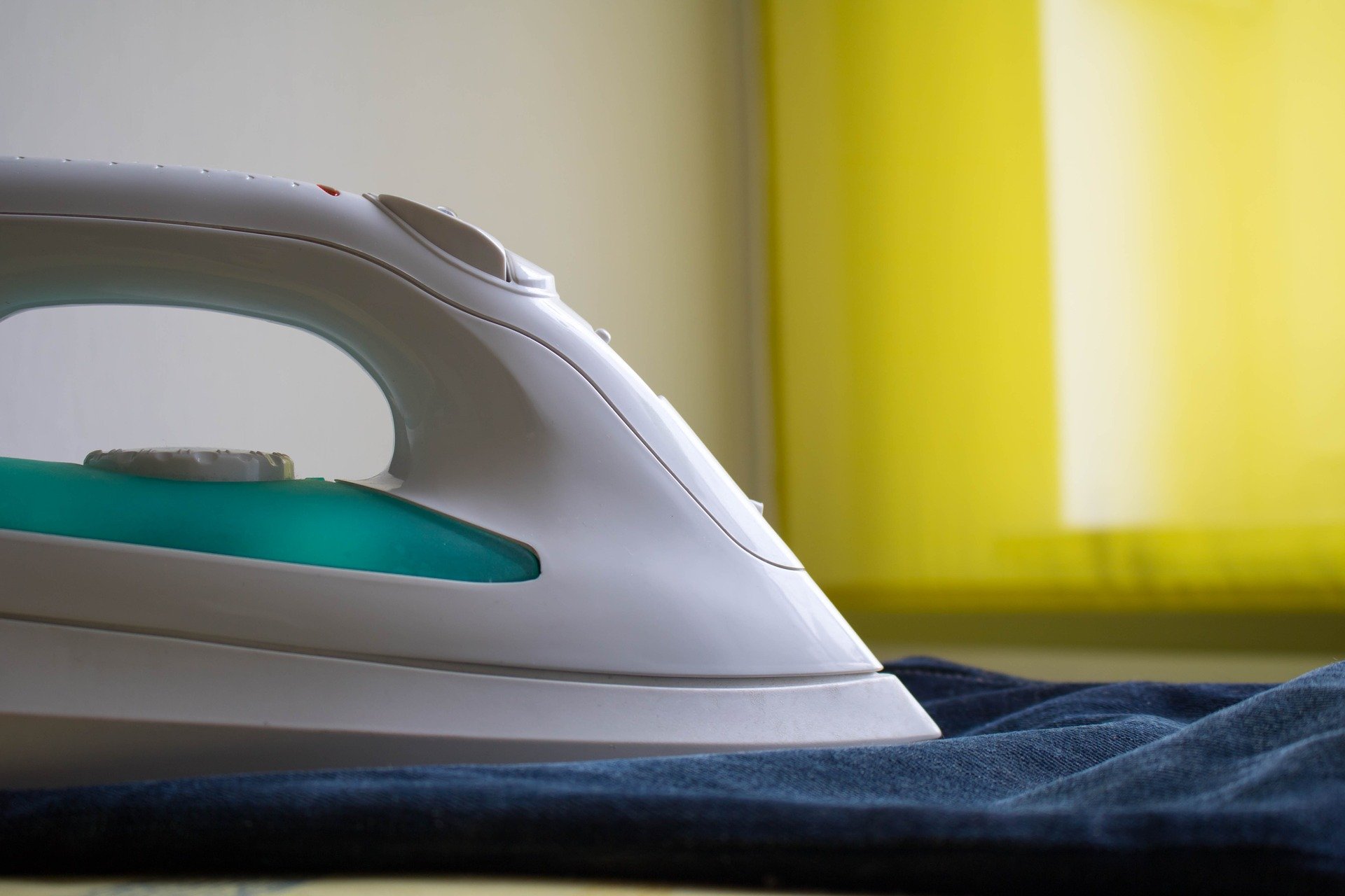 Man ironing jeans