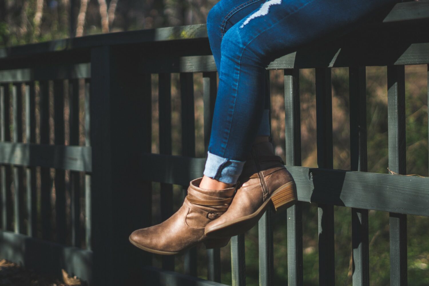 Woman wearing cuffed jeans and booties