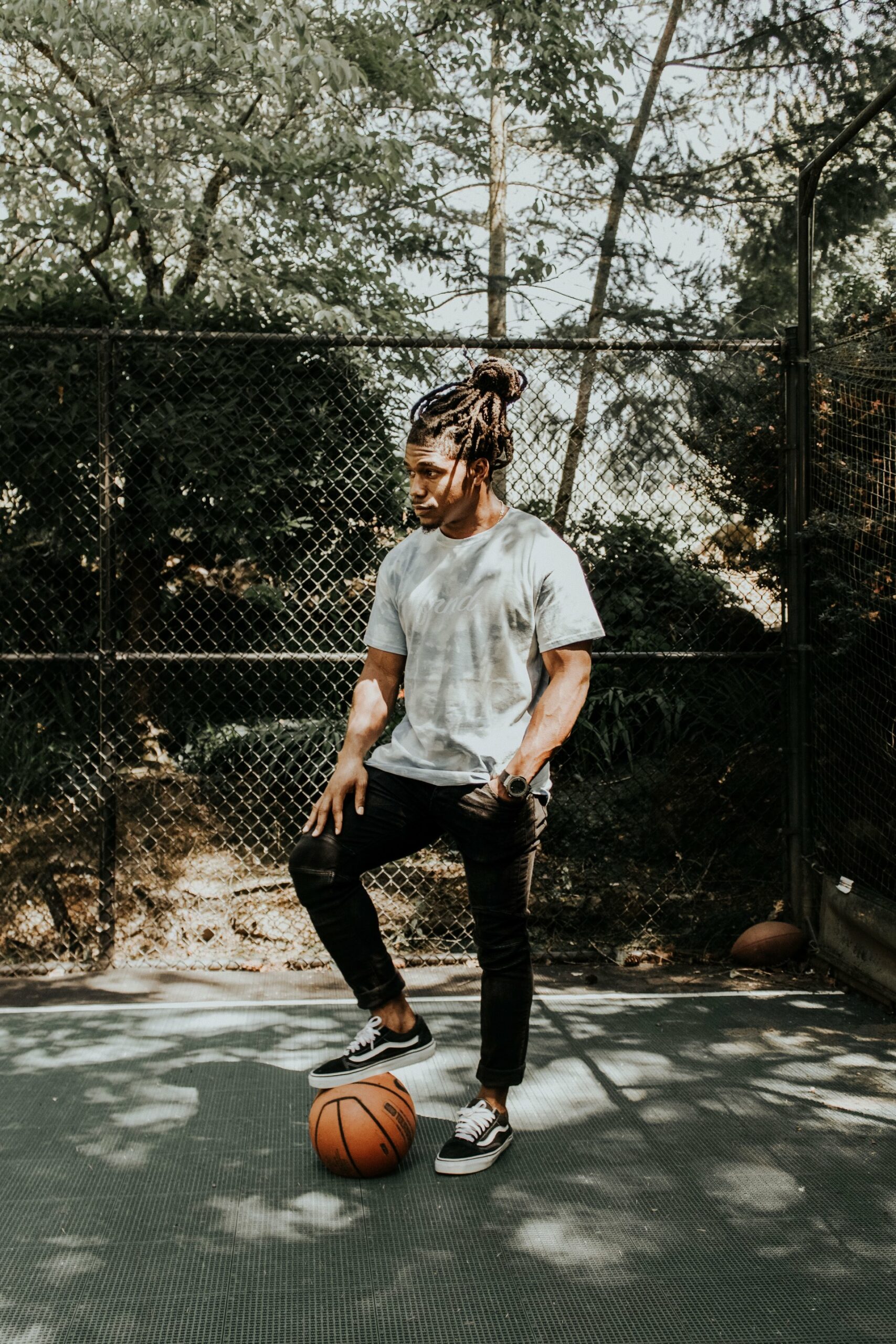 Man wearing black jeans and white shirt