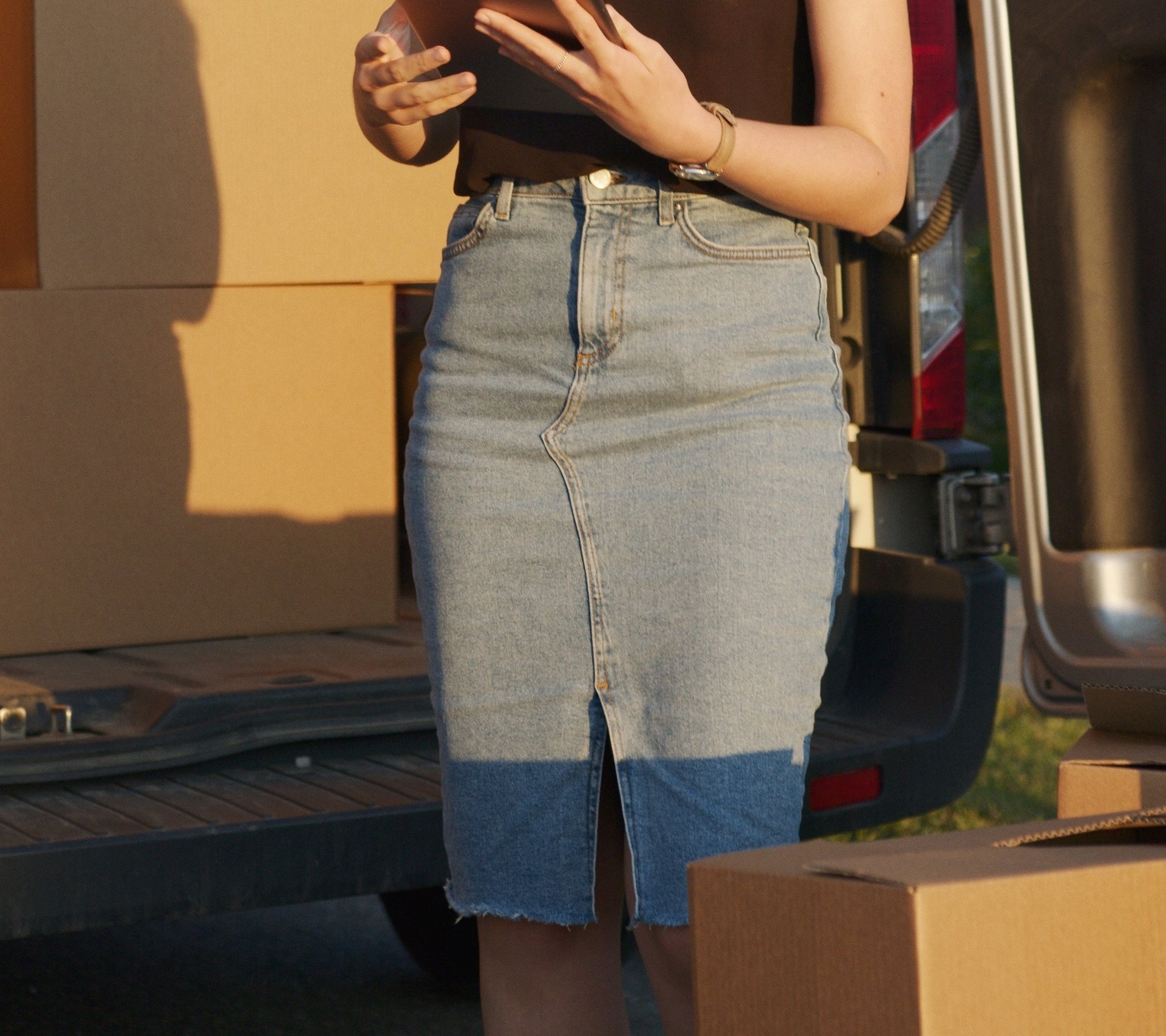 Woman wearing long denim skirt