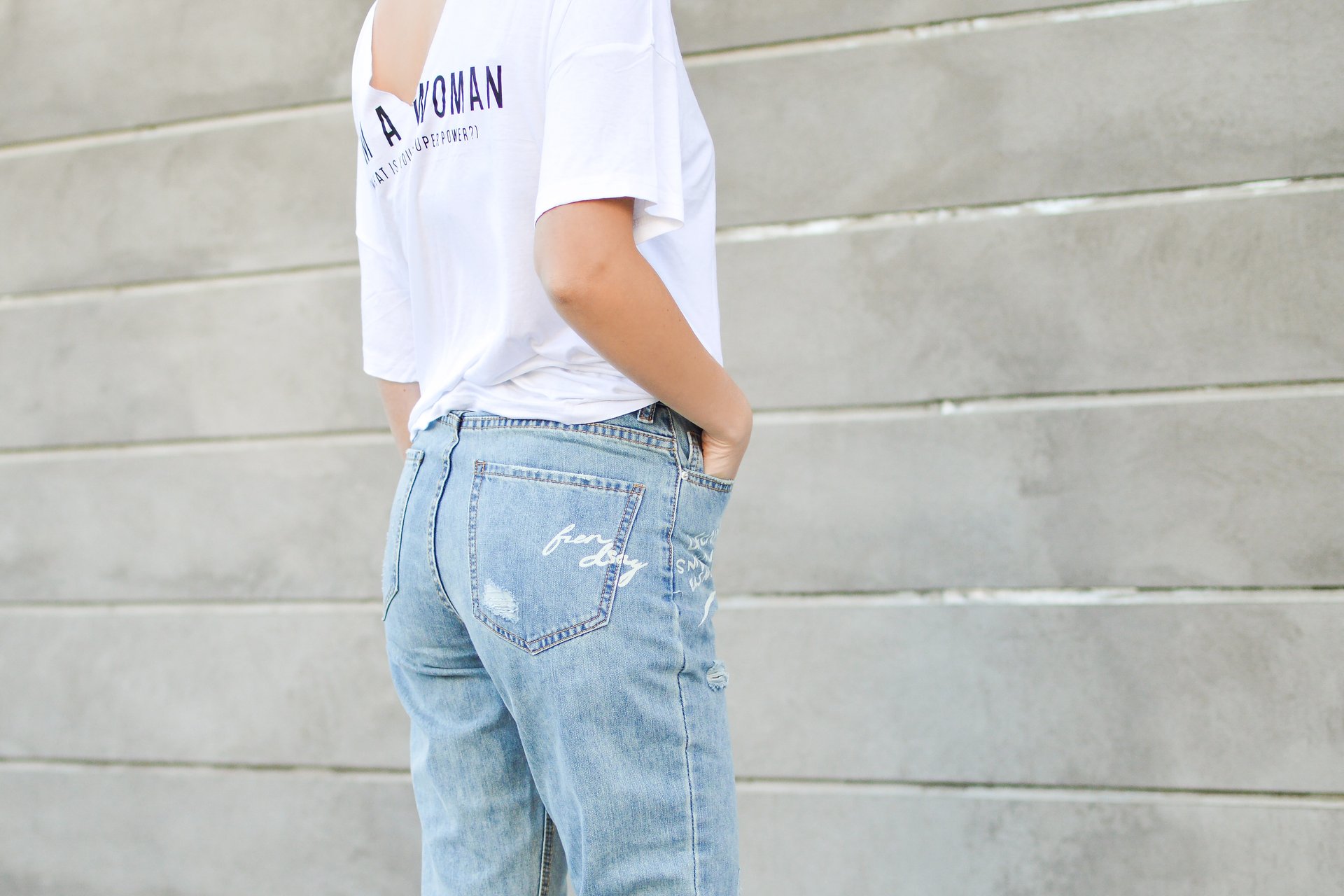 Woman wearing jeans and white top