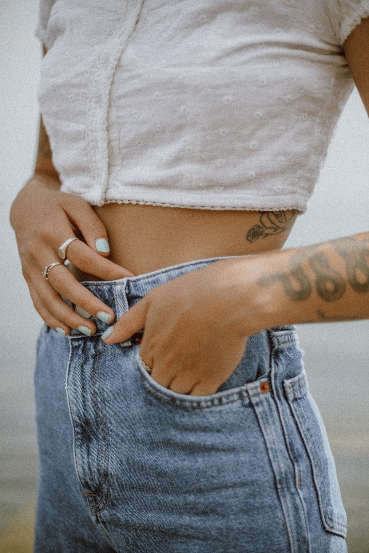 Woman wearing crop top with jeans